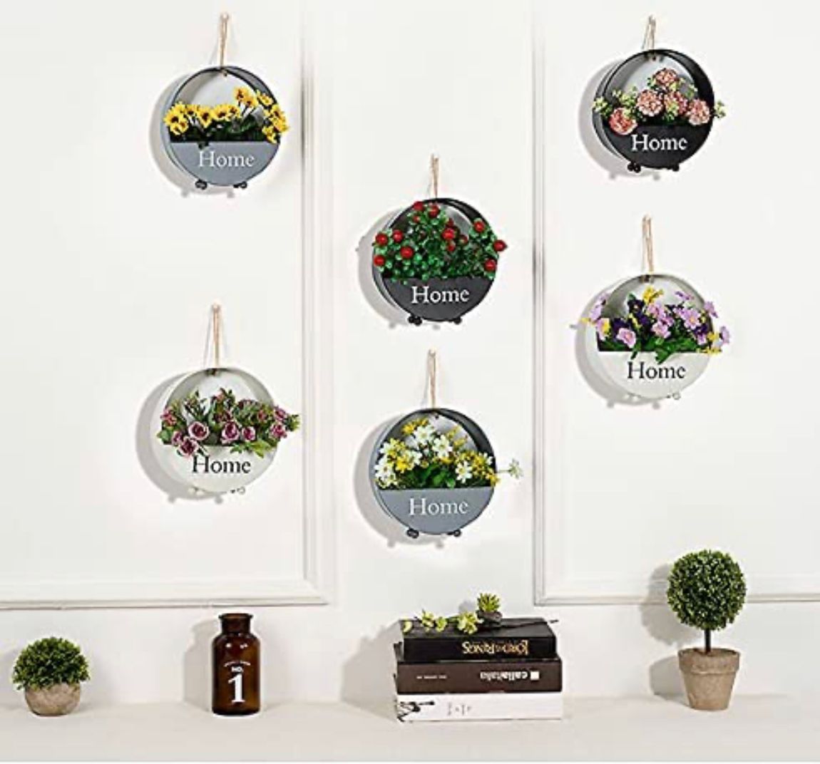 Wall-mounted circular black planter