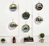 Wall-mounted circular black planter