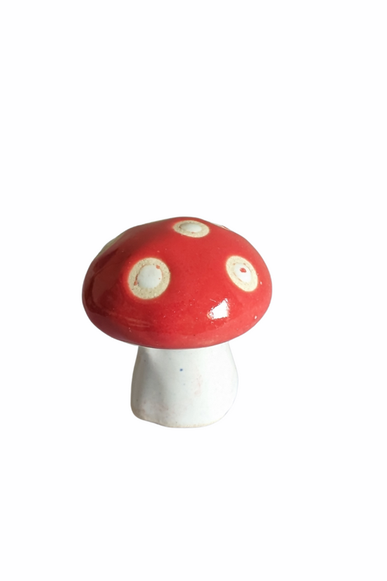 Green spotted mushroom figure for garden