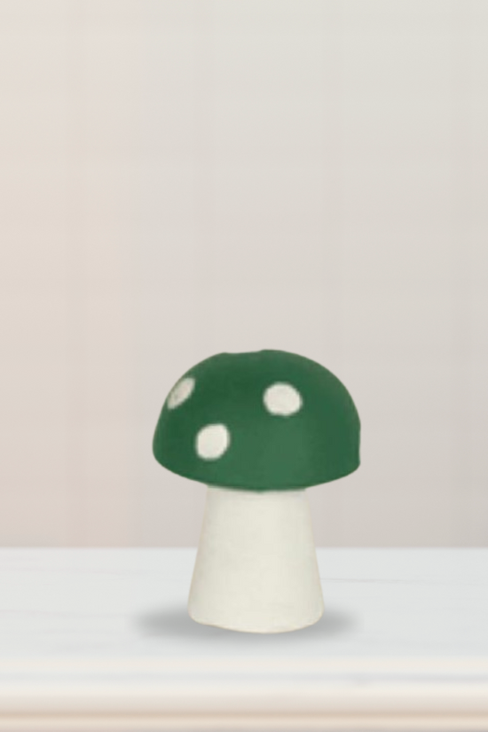 Green spotted mushroom figure for garden