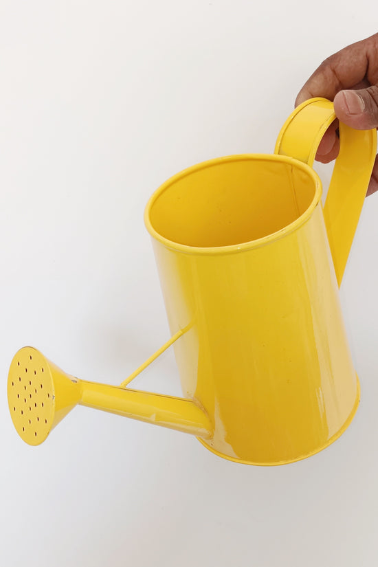 Yellow garden watering can
