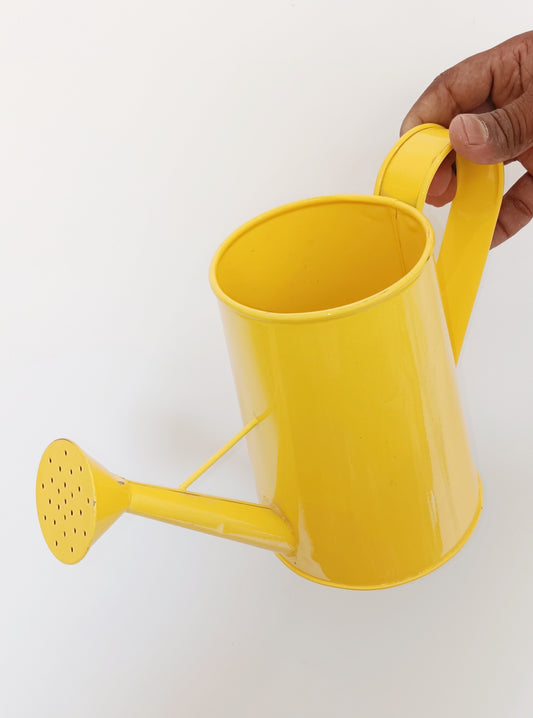 Yellow garden watering can
