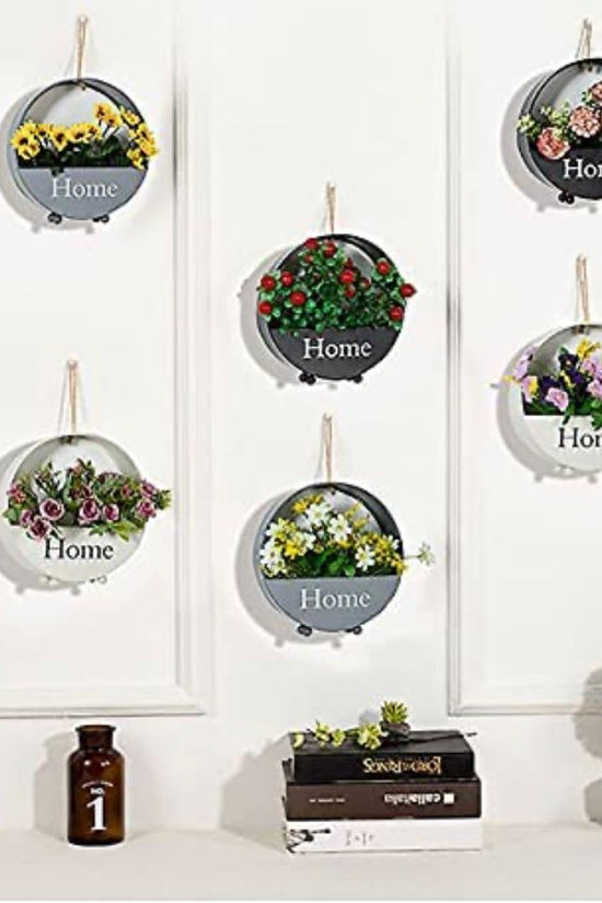 Wall-mounted circular black planter
