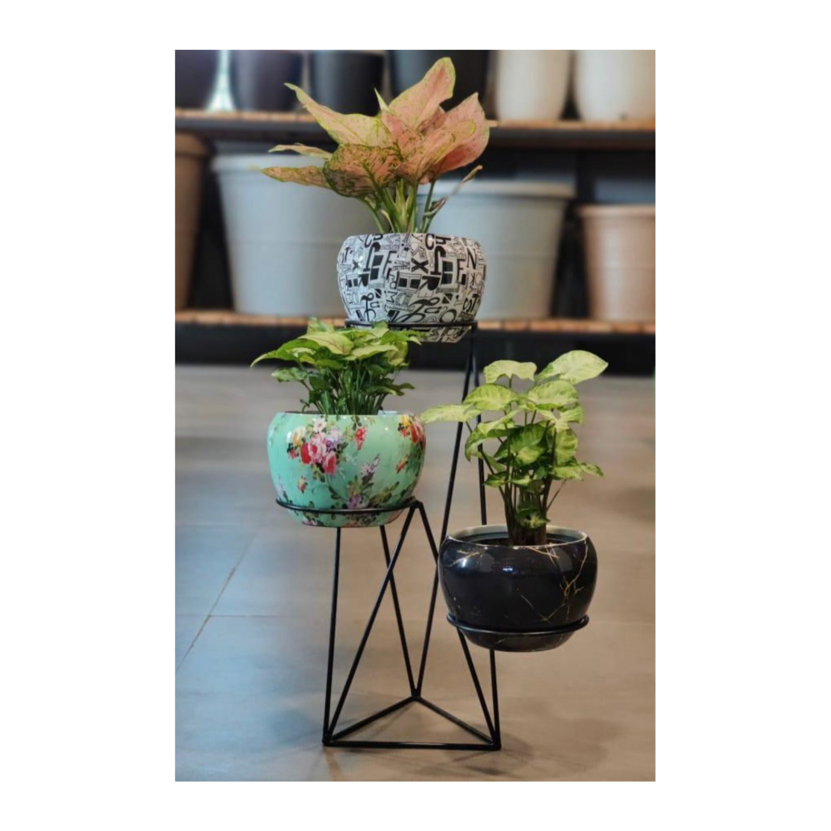 Vertical metal plant stand with pots
