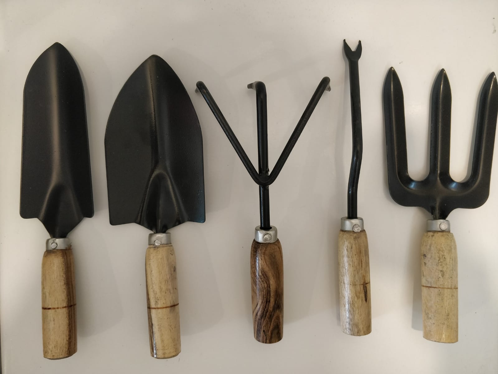 Gardening hand tools with wooden handles
